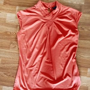 Worthing orange sleeveless blouse with keyhole in back. Size women's medium.